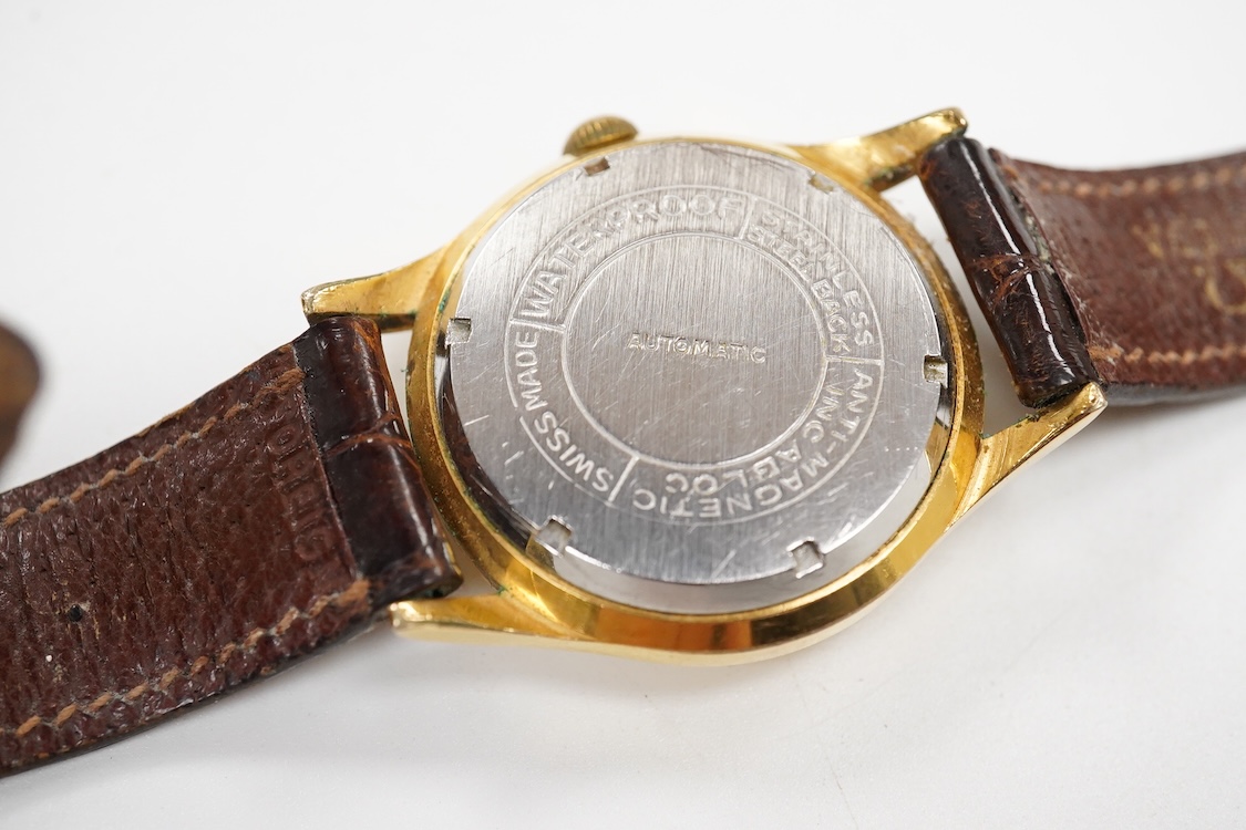 A gentleman's mid 20th century steel and gold plated Arden 'Super Automatic' wrist watch, with baton and Arabic numerals and seep seconds with red arrow pointer, case diameter 33mm, on an Omega brown leather strap.